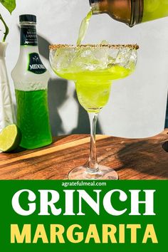 a green drink being poured into a glass with the words grinch margarita on it