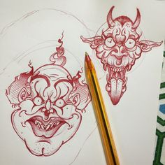 two red ink drawings on white paper with a pencil in the foreground and a drawing of a demon