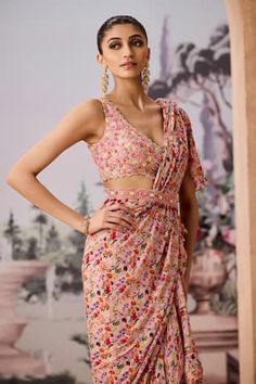 Peach pre-draped ruffle saree in floral chintz print and frilled tiers. Comes with sequin, bead and pearl embellished padded blouse. Paired with scalloped embellished belt. - Aza Fashions Fitted Floral Print Saree For Party, V-neck Party Dress For Diwali, Summer Fitted Georgette Blouse Piece, Diwali Georgette V-neck Dress, Fitted Pre-draped Saree For Festive Spring Occasions, Fitted Spring Festive Pre-draped Saree, Fitted Festive Spring Pre-draped Saree, Fitted V-neck Pre-draped Saree, Fitted Saree For Summer Parties