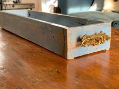 an old wooden box sitting on top of a table