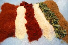 several different types of spices on top of each other, including red and white stuff