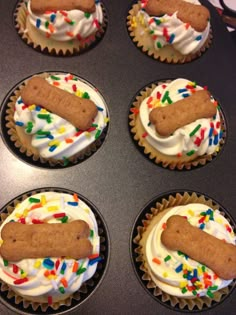 six cupcakes with frosting and sprinkles in a muffin tin