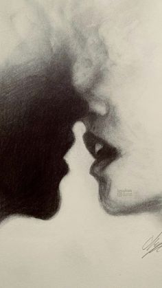 a black and white photo of two people's faces with their noses touching each other