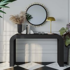 a white console table with plants and a round mirror