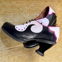 One Of The Best Loved Of The Fluevog Families, Discontinued Kkbb, Or Kitschy Kischy Boom Boom, Viv In Black And White With Pink Piping, Size 7. It Is A Low-Heel Pump, Leather Lace-Up, Easy On The Feet, Solid With A Rubber Sole. Confidence Booster. Fits: Touch Short In The Toe Box But True Width. From The Flueseum: “Viv Is Kickin' It Old School. Her Design Is Straight Out Of The Fluevog History Books And Her Style Is As Eternal As A Red Lip. The Kitschy Kitschy Boom Boom Family Exhumes Classic St Kickin It Old School, 70s Shoes, 90s Shoes, John Fluevog Shoes, Fluevog Shoes, John Fluevog, Low Heel Pumps, Funky Shoes, Red Lip