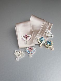 "Fun and flirty sparkly shoe clips made with the finest Swarovski crystals. Mix and match for a unique personalized look. Each clip measures 1\" wide and 1 1/4\" long. Available in gold, rose gold or silver finish. Easy to use clip-on style. The price includes one pair of clips. Available in aquamarine, amethyst or all clear crystal." Luxury Women's Shoe Clips For Formal Occasions, Shoe Embellishments, Bridal Shoe, Sparkly Shoes, Crystal Belt, Wedding Sash Belt, Rhinestone Shoes, Crystal Shoes, Wedding Belts