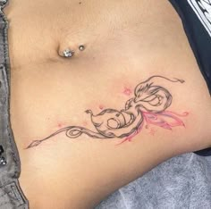 a woman's stomach with a tattoo on it