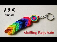 the keychain is made out of multicolored paper and has a spiral design