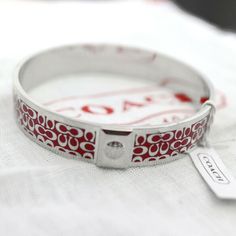 Brand New with Tag,   *** 100% Authentic***  COACH 1/2" Red Signature Bangle Bracelet Style:96855    COACH Red Signature C Covered the whole bangle COACH Script Logo engraved inside the bangle 1/2" wide One size : 7.75 Circumference Or 2.5 Inches Diameter ______________________________________________ This item is 100% Authentic. Buy with confidence! Come from Pet Free, Non-Smoking Home. if you've changed your mind about something you've bough, (Item still brand new),I accept return within 30 da Coach Bracelets As Gift, Coach Bangle Bracelets Gift, Coach Silver Bangle Bracelet, Coach Silver Bangle Bracelets, Silver Coach Bracelet Gift, Silver Coach Bracelet For Gift, Silver Coach Bracelet As Gift, Silver Coach Bracelets As A Gift, You've Changed