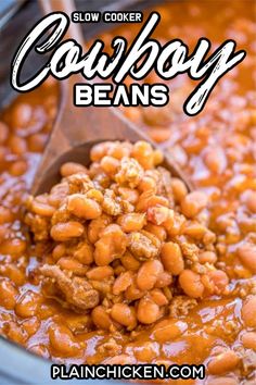 slow cooker cowboy beans in a crock pot with a wooden spoon and text overlay that reads slow cooker cowboy beans