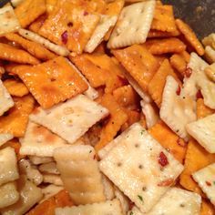 a close up view of cheesy crackers and other food items in a bowl