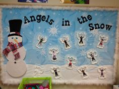 a bulletin board with an angel in the snow theme