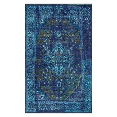 a blue rug with an intricate design on the front and back side, in different colors