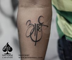 a man with a tattoo on his arm has the word faith written in black ink