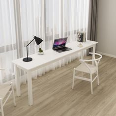 a white desk with a laptop on it in front of a curtained window next to a chair