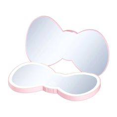 an oval shaped mirror with pink trim on the bottom and sides, in front of a white background