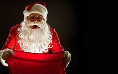 a man dressed as santa claus holding a red bag