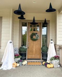 halloween decorations on the front porch of a house