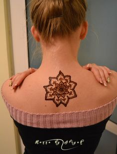 a woman with a tattoo on her back