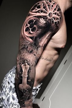 a man's half sleeve with an eagle and chess piece tattoo on his left arm