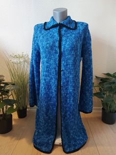 Handmade,long, blue, crochet jacket with long sleeves. Its made with a lightblue/darkblue yarn, and edged with a black cotton yarn. It can be used with a lot off different variations in the buttoning, that goes from top to bottom with push buttons. The jacket shapes beautiful to the body, and will keep you warm in colder temperatures. It can be used in all the different varietys as both everyday wear and formal wear. Comfortable to wear and also practical. I really like to make my owm recipies a Bohemian Blue Long Sleeve Sweater Coat, Handmade Bohemian Blue Outerwear, Blue Open Knit Winter Outerwear, Blue Hand Knitted Knit Outerwear, Fitted Crochet Blue Cardigan, Fitted Blue Crochet Cardigan, Blue Hand-knitted Winter Outerwear, Cold Temperature, Crochet Jacket