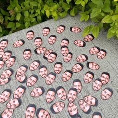 a group of people's faces are placed on the ground