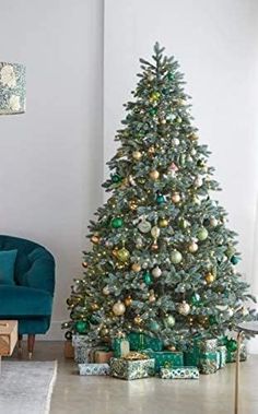 a living room with a christmas tree in the corner