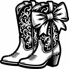 a cowboy boot with a bow on the side and an ornate design in black and white