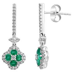 A unique pair of earrings featuring open work floral design. Lush green round emeralds weigh 0.68 carats in total which are surrounded by brilliant-cut diamonds weighing 0.56 carats. Diamond Drop Earrings, Diamond Drops, Drop Earring, Emerald Diamond, Lush Green, Brilliant Cut Diamond, Lush, Emerald, Floral Design