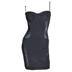 An incredible black dress from Moschino. It is lingerie inspired with an adjustable straps boned bra style top plus front and back panels of stretch bandage fabric. There are semi sheer side panels at the waist and thighs and it has a center back zipper. Fits sizes Small, Medium. Marked US size 8. Bust 34" Waist 28" Hips 37.50" Length 33" Boned Bra, Guilded Glamour, Evil Vampire, Vampire Core, Moschino Dress, Goth Clothing, Daisy Jones, Girls Couture, Digital Closet