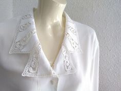 Vintage from the 1990s Materials: cutwork lace collar blouse 90s EFRO embroidered collar blouse, romantic oversize blouse, 48 size, minimalist off-white blouse, cutwork collar blouse, lace collar blouse.The fabric is polyester, not silky polyester, is normal, ribbed polyester. PLEASE CHECK THE MEASUREMENTS CAREFULLY BECAUSE THE BLOUSE IS OVERSIZE. measurements lying flat : shoulders :49 cm (19,5 inches) bust:62 cm (24,5 inches) total length :82 cm (32,5 inches) sleeve length :32 cm (12 inches) Oversize Blouse, Blouse Lace, Embroidered Collars, Oversized Blouse, Lace Collar, Collar Blouse, Cut Work, White Blouse, Lace Blouse