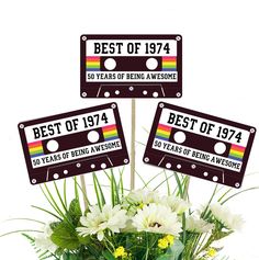 the best of 1974 and 90 years of being awesome are placed in a vase with flowers