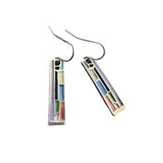 pair of multicolored rectangular earrings on silver earwires against a white background