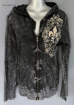 "New VOCAL APPAREL Womens Embellished Crystal Black Mineral Dyed Fleur de Lis Full Zip Jacket Size Small - Runs Big This incredibly unique Vocal studded jacket is just stunning. Gorgeous black mineral tone. Beautiful crystal embellished fleur de lis on front and back. Crocheted Lace Contrast on Sides. Full zipper front closure. Hoodie style. Just GORGEOUS Made in USA by Vocal Apparel I have been selling Vocal clothing for 16 YEARS now and just LOVE this brand! 100% Cotton Material has stretch Measured without stretching - *Small - approx. 18\" across chest *Approximately 27\" in length BE VOCAL - STAND OUT IN A CROWD & PUT A GIRL IN IT before it's gone! XOXO Lisa - Put a Girl In It Always free shipping - Returns accepted within 14 days. In the event of a return/original shipping costs will