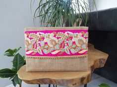 This floral clutch will bring elegance to your style. It will be chic with jeans or dresses and you may use this boho bag both day and night. This clutch wallet is perfectly handmade with high quality natural jute fabric. Designed with a silk bohemian embroidery and a tassel. Clutch has a pink silk satin interfacing and a padding inside to stand upright. Closes with a magnet closing. This bag is designed to fit all the things you need for comfortable everyday busy life. There will be enough spac Trendy Wedding Clutch Bag, Beige Clutch Pouch For Parties, Trendy Beige Evening Bag As Gift, Beige Clutch Evening Bag For Festive Occasions, Trendy Clutch Evening Bag For Wedding, Trendy Beige Evening Bag For Gift, Festive Beige Evening Clutch, Chic Beige Pouch For Gift, Festive Beige Rectangular Evening Bag