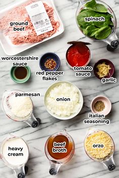 the ingredients to make an italian pasta dish laid out on a marble counter top, including sauces and seasonings