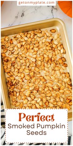 a baking pan filled with baked pumpkin seeds