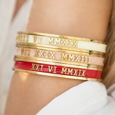 ♥ Personalised Roman Numeral Date Bangles ♥ handmade with bespoke dates ♥ Valentines Gift ♥ Anniversary Present ♥ Wedding Day Jewellery ♥ 30th Birthday Gift, 40th Birthday Gift, 50th Birthday Gift or 60th Birthday Gift ♥ Christmas Gift For Her ♥  These bracelets come in Gold, Silver or Rose Gold with a range of enamel colours (see picture for full range).  Key information: ► Small size has a 5.9cm diameter / 18.50cm Circumference (slides over whole hand - does not open up!) ► Regular size has a 6.4cm diameter / 20.10cm Circumference (slides over whole hand - does not open up ► Comes in a ribbon tied gift box, great for travelling ► Handmade in London ► 100% waterproof, safe in the shower, pool, sweat and sea ► Dipped in a heavy 18k gold that lasts forever ► UK delivery is FREE! Worldwide s Grey Blending, Top Selling Jewelry, Roman Numerals Dates, Roman Numeral Bracelet, Custom Engraved Bracelet, Wedding Day Jewelry, 60th Birthday Gifts, Handmade Bangles, 30th Birthday Gifts