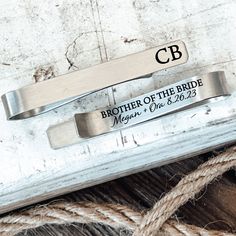 "✨This Personalized Tie Clip can come with your personalized initials on the front, and with \"Brother of the Bride\" and your personalized names and date on the back. Great gift for your Brother at your Wedding.✨ *Includes: 1 Silver Stainless Steel Tie Clip *Professionally Engraved for a permanent design that will NOT fade over time *100% Designed and Handmade in California, USA *Shipping Upgrades Available at Checkout *Size & Material: HIGH Quality Stainless Steel: 1 7/8 inch (47.65mm)" Gifts For Brides Parents, Groomsmen Tie Clip, Wedding Party Gifts Groomsmen, Graduation Gifts For Boys, Personalized Tie Clip, Birthday Gifts For Brother, Godfather Gifts, Nephew Gifts, Cadeau Parents