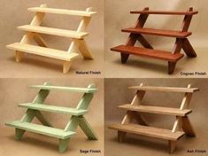 four different colored wooden benches sitting next to each other