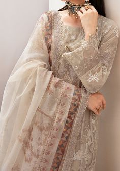 Introducing our Chiffon collection DASTAN by Ramsha designed to make you look and feel your best These pieces will add a touch of class and elegance to your wardrobe. This collection is a beautiful collection of ensembles offering versatile compositions for the latest festive wardrobe requirements. Embroidered Chiffon Front With Sequence. Embroidered Chiffon Back and Sleeves. Embroidered Organza Lace. Embroidered Organza Ghera, and Trouser Lace. Embroidered Net Dupatta. Raw Silk Trouser. Color: There might be slight color variation due to lighting and flashes while the photo shooting. The color may also vary because of different screen resolutions. Wash Care: Dry Clean Only. Elegant Sheer Sets For Festive Occasions, Elegant Sheer Sets For Festive Season, Elegant Cream Georgette Sets, Elegant Beige Georgette Sets, Elegant Designer Cream Dresses, Elegant Cream Designer Dresses, Eid Organza Dresses, Straight Kurta Style, Organza Straight Kurta Dress For Eid, Festive Beige Georgette Dress