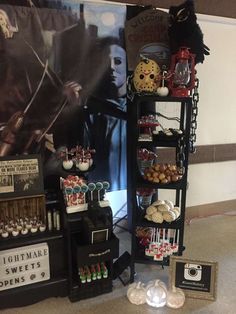 an assortment of harry potter treats on display in front of a movie poster and other items