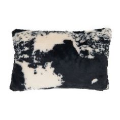 a black and white pillow on a white background