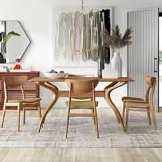 a dining room table and chairs in front of an open door with mirrors on the wall