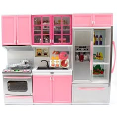 a toy kitchen with pink cabinets and appliances