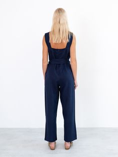 "DAKOTA is a sleeveless jumpsuit with belt. DETAILS - Tank style top - Sleeveless design - Zip closure at the back - Self tie belt - 100% midweight European linen fabric - Cut and sewn to order just for you in our studio COLOR - Navy Blue, you can also choose other colors above - Fabric samples are available here https://www.etsy.com/listing/586569696/linen-fabric-samples SIZING & FIT - Fits true to size - Inseam is approximately 27 inches / length 68.5 cm - Bust is approximately 21 inches / Belted Strapless Jumpsuit For Workwear, Blue Belted Jumpsuit For Summer, Elegant Sleeveless Linen Jumpsuit, Chic Sleeveless Jumpsuits And Rompers With Tie Waist, Chic Fitted Denim Jumpsuit With Belt Loops, Chic Denim Jumpsuit With Belt Loops, Fitted Sleeveless Jumpsuit With Belt Loops, Belted Strapless Sleeveless Jumpsuit, Belted Strapless Jumpsuit