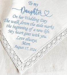 a wedding handkerchief with the words to my daughter on her wedding day written in blue ink