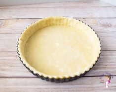 an uncooked pie crust on a wooden table