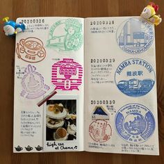 an open book with various stamps on it