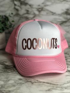 "Coconuts hat, pictured here in the kids small size in gray/white with the design in gold foil. Neon pink heart will be added unless requested otherwise- if you want a different colored heart or no heart just leave a note in the comments at checkout. These unique custom MADE TO ORDER hats are truely one of a kind. Not all heads are created equal , which is why we have so many size options. You can customize your hat color, size and your favorite design. please note all hat colors vary by size, i Neon Pink Heart, Kids Hat, Kids Hats, Custom Hats, Pink Heart, Trucker Cap, Neon Pink, Gold Foil, Gray White